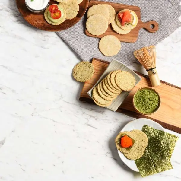 Brown rice crackers selection set with assorted flavors displayed on serving