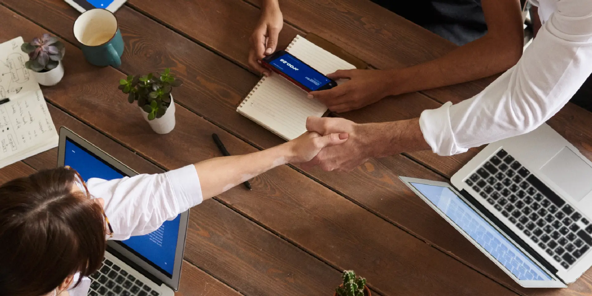 mercorp contact us banner showing business handshake and communication