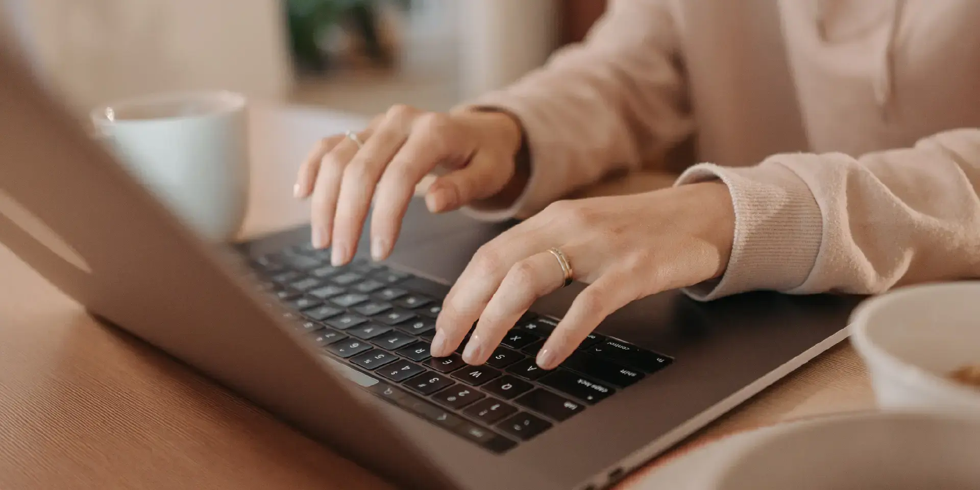customer typing on laptop for support or inquiry