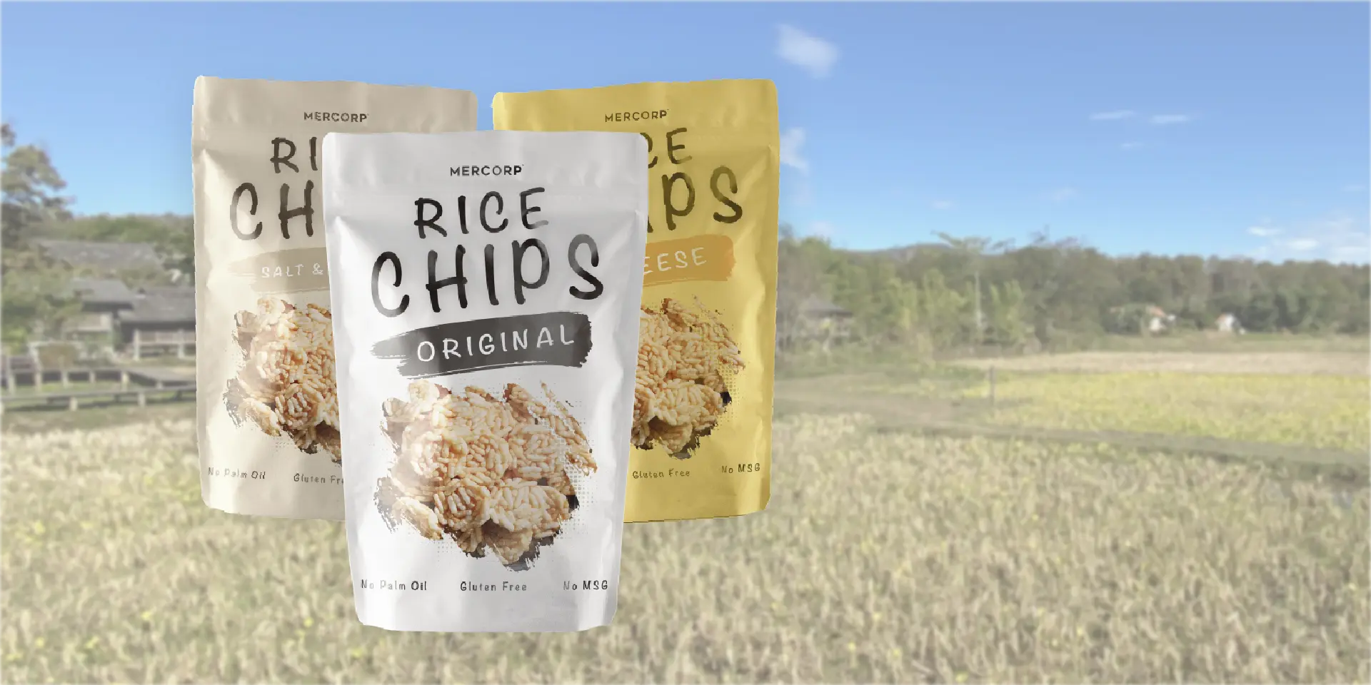 mercorp rice chips assorted flavors displayed on natural rice field background