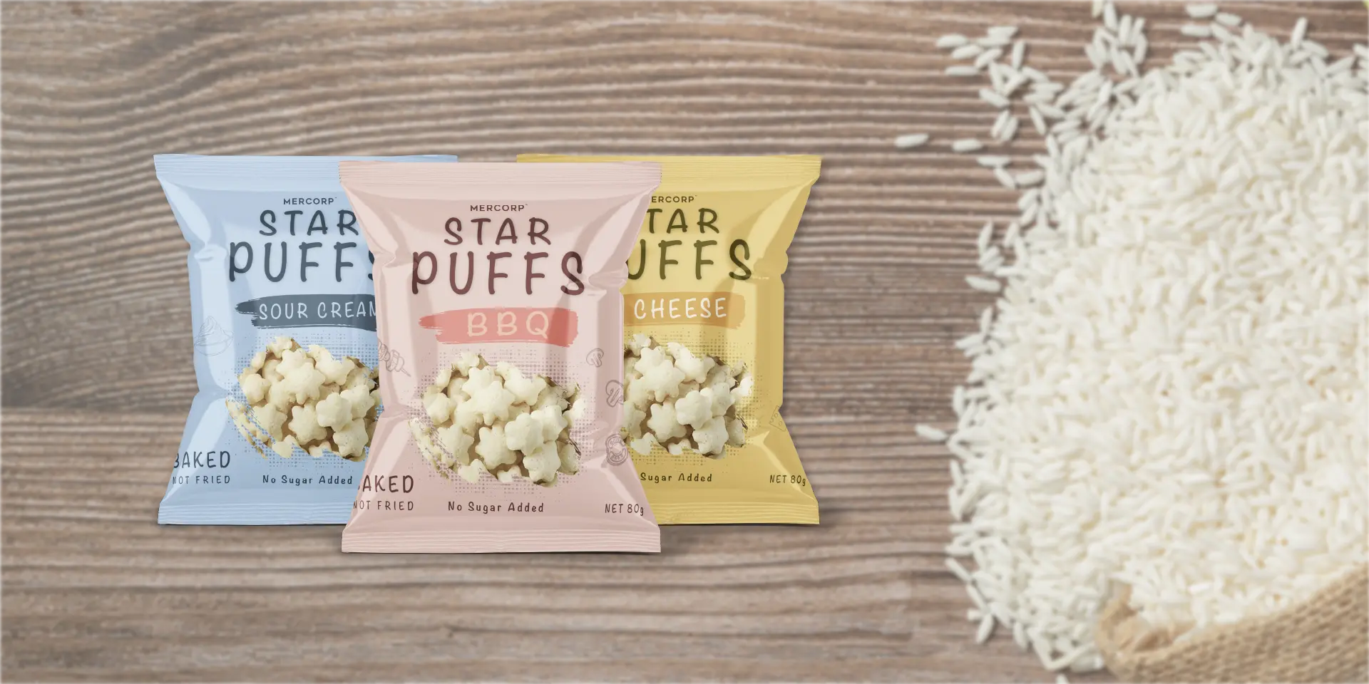 mercorp star puffs assorted flavors rice snack on wooden background with rice grains